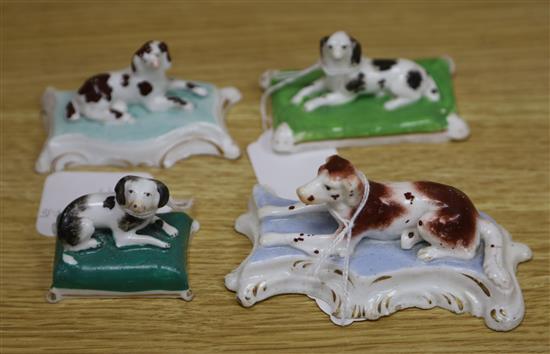 Four Staffordshire porcelain recumbent figures of three spaniels and a setter, c.1835-50, 5.8 -12cm